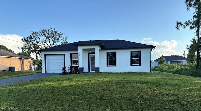 3310 14th St W, Lehigh Acres, FL 33971 - view of front of house featuring driveway, a garage, stucco siding, and a front lawn