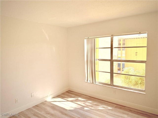 empty room with light wood-type flooring