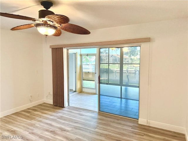 entryway featuring ceiling fan and light hardwood / wood-style floors