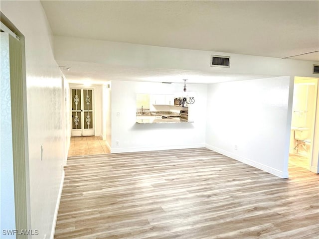 empty room with light wood-type flooring