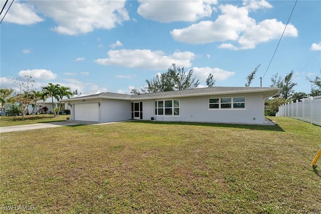 ranch-style house with a garage, fence, concrete driveway, and a front yard