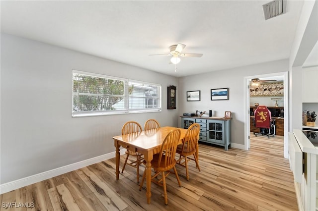 2084 Coral Point Dr, Cape Coral, FL 33990 - dining area with visible vents, baseboards, light wood-style flooring, and ceiling fan