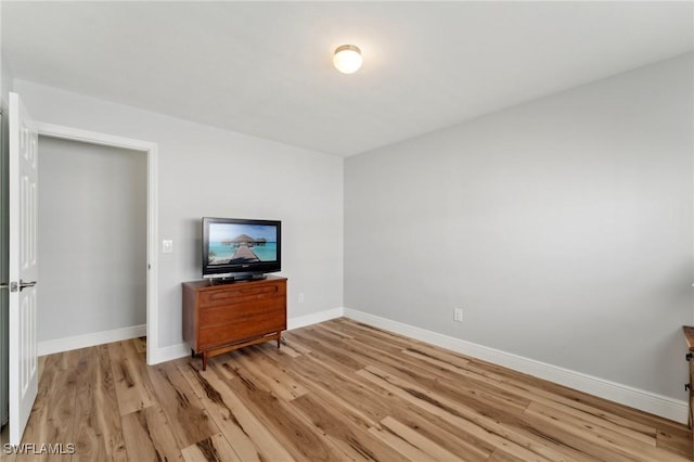 2084 Coral Point Dr, Cape Coral, FL 33990 - unfurnished living room featuring light wood-style floors and baseboards