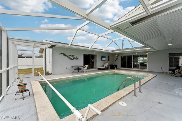 2084 Coral Point Dr, Cape Coral, FL 33990 - pool featuring fence, glass enclosure, and a patio