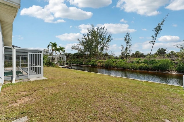 2084 Coral Point Dr, Cape Coral, FL 33990 - view of yard with a lanai and a water view