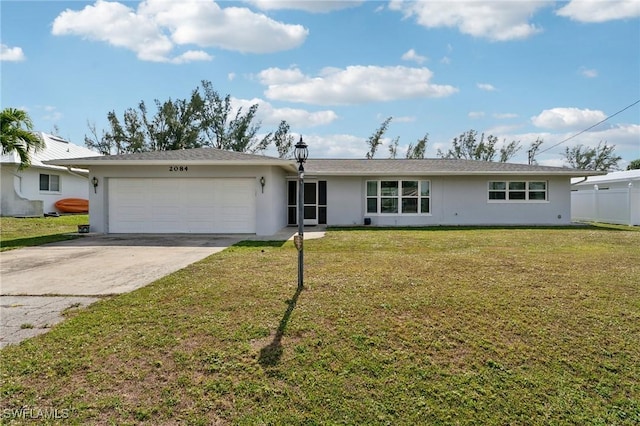 single story home featuring a garage, fence, concrete driveway, stucco siding, and a front yard