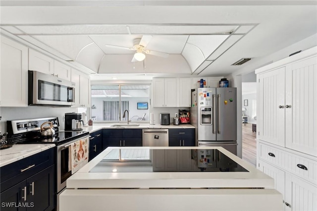 2084 Coral Point Dr, Cape Coral, FL 33990 - kitchen featuring ceiling fan, white cabinetry, light countertops, a sink, and stainless steel appliances