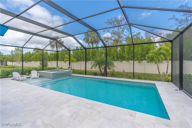 view of pool with a lanai, an in ground hot tub, and a patio