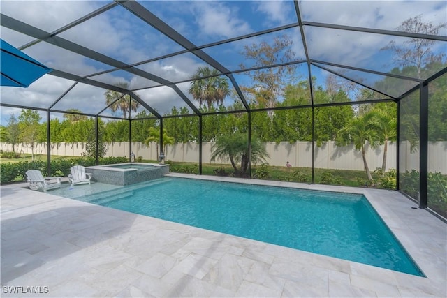 view of swimming pool with a patio, a lanai, and an in ground hot tub