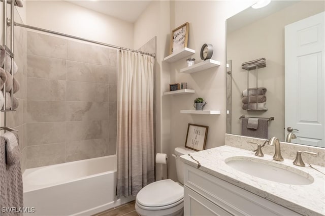 full bathroom featuring vanity, toilet, and shower / tub combo with curtain