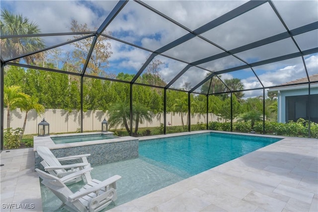 view of swimming pool with a lanai, an in ground hot tub, and a patio