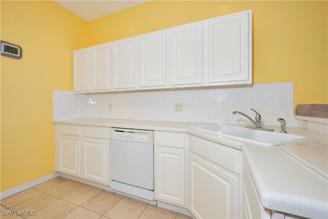 kitchen with tasteful backsplash, dishwasher, white cabinets, light tile patterned flooring, and sink