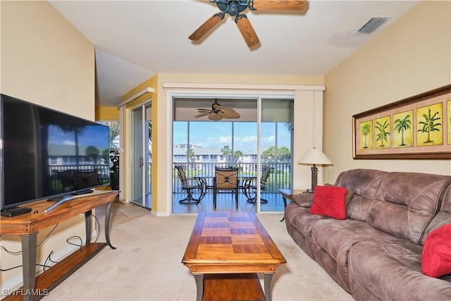 living room with light colored carpet and ceiling fan