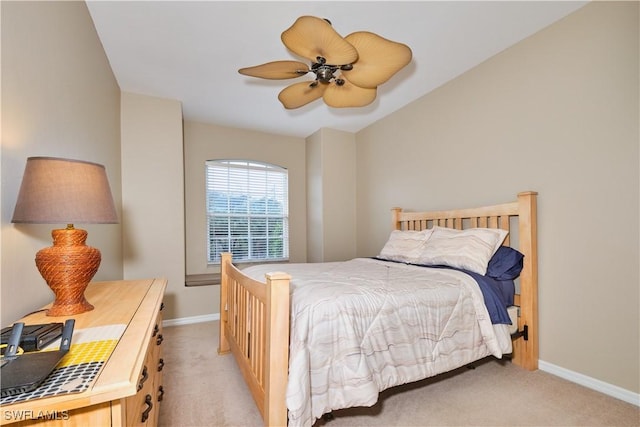 bedroom featuring light colored carpet and ceiling fan