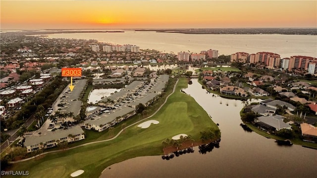 aerial view at dusk with a water view