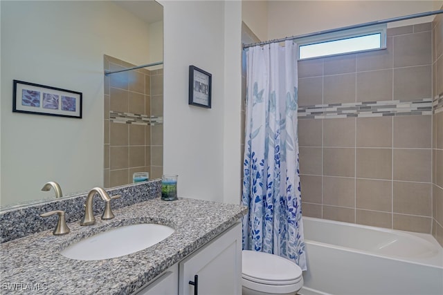 bathroom with toilet, shower / bath combo with shower curtain, and vanity