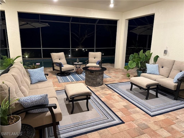 view of patio / terrace featuring an outdoor living space with a fire pit