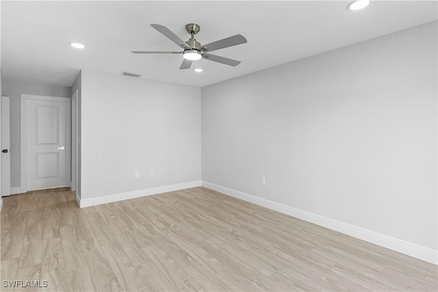 empty room featuring light hardwood / wood-style floors and ceiling fan