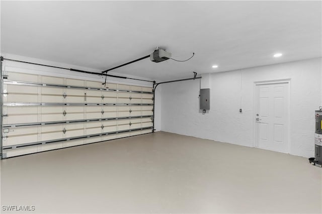 garage with electric panel and a garage door opener