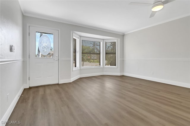 foyer entrance featuring crown molding, ceiling fan, and wood-type flooring