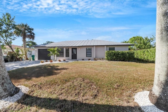 single story home featuring a garage and a front lawn