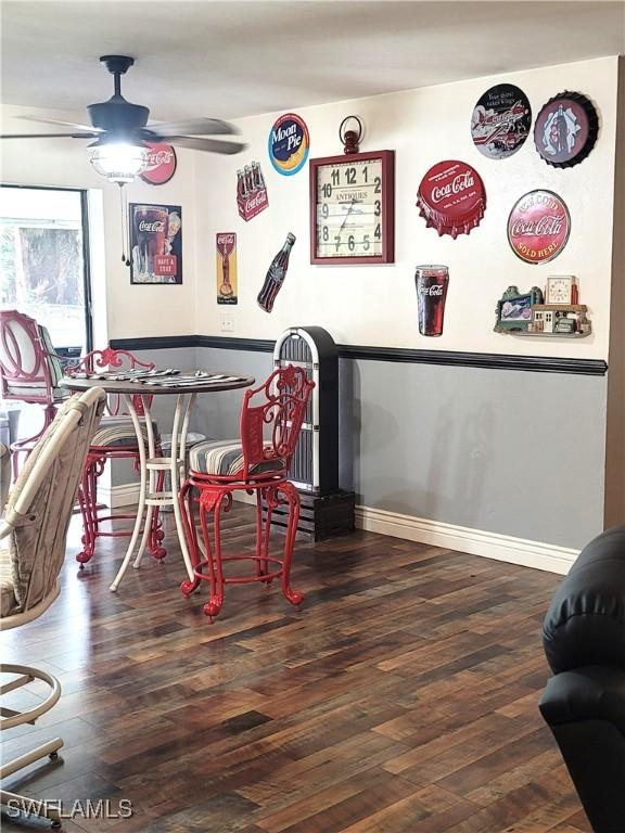 interior space featuring dark wood-type flooring and ceiling fan