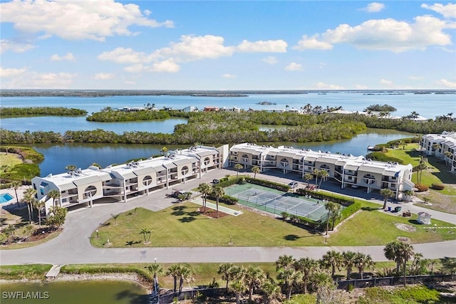 birds eye view of property with a water view