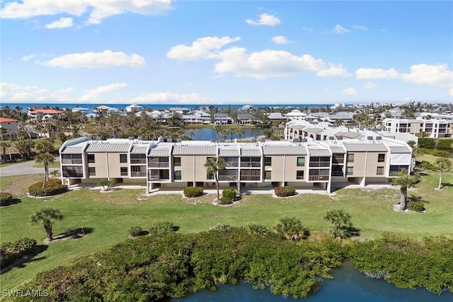 birds eye view of property with a water view