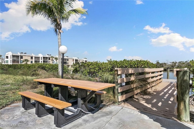 view of property's community featuring outdoor dining area