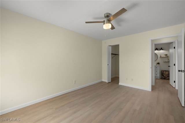 unfurnished bedroom with ceiling fan, a closet, and light hardwood / wood-style flooring