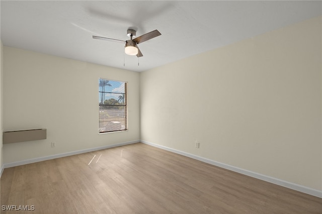 unfurnished room with light hardwood / wood-style floors and ceiling fan