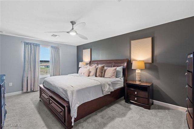 bedroom featuring a ceiling fan, carpet, visible vents, and baseboards