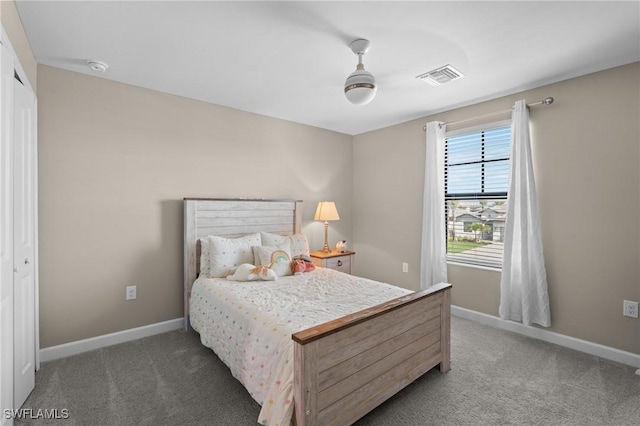 bedroom featuring baseboards, visible vents, and carpet flooring