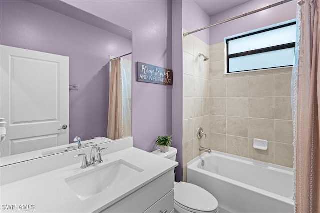 bathroom featuring toilet, shower / bath combination with curtain, and vanity