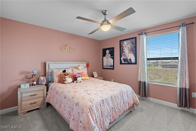 bedroom with ceiling fan, carpet floors, and baseboards