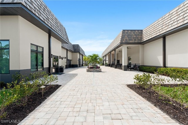 view of home's community with a patio area