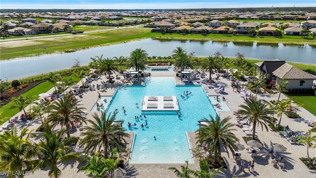 bird's eye view with a water view and a residential view