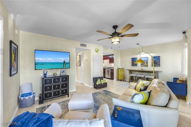 tiled living room with ceiling fan