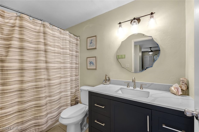 bathroom featuring vanity, tile patterned flooring, a shower with curtain, and toilet