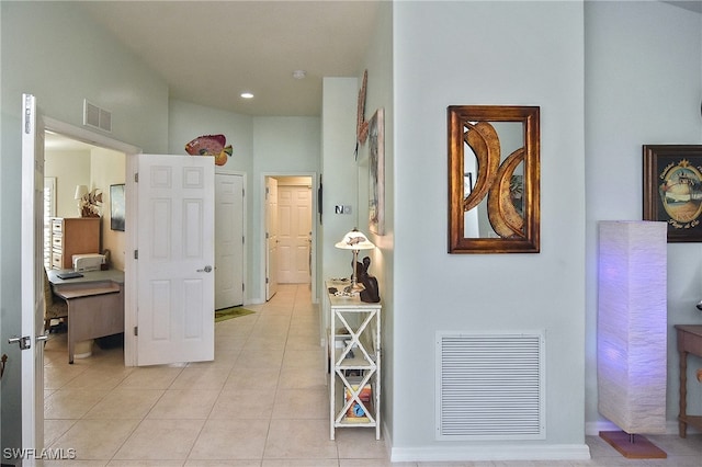 corridor with light tile patterned flooring