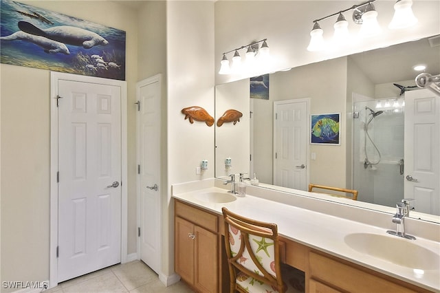 bathroom featuring vanity, tile patterned flooring, and a shower with shower door