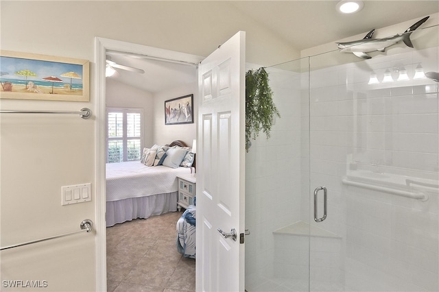 bathroom with vaulted ceiling, tile patterned floors, and walk in shower