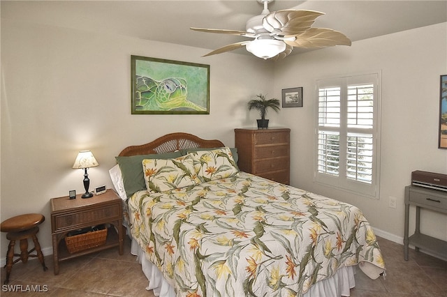 bedroom with tile patterned floors and ceiling fan