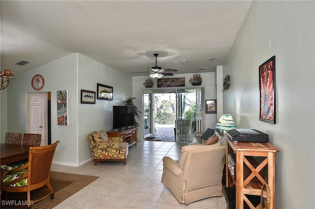 living room with ceiling fan and light tile patterned floors