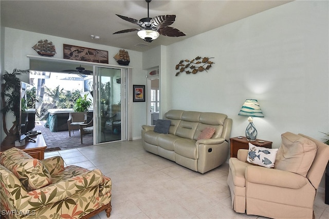 tiled living room with ceiling fan