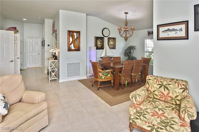 dining room with light tile patterned flooring, vaulted ceiling, and an inviting chandelier