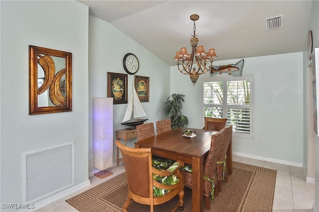 dining space featuring light tile patterned flooring, vaulted ceiling, and a chandelier