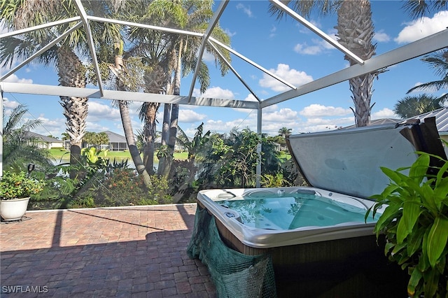 view of patio with a hot tub