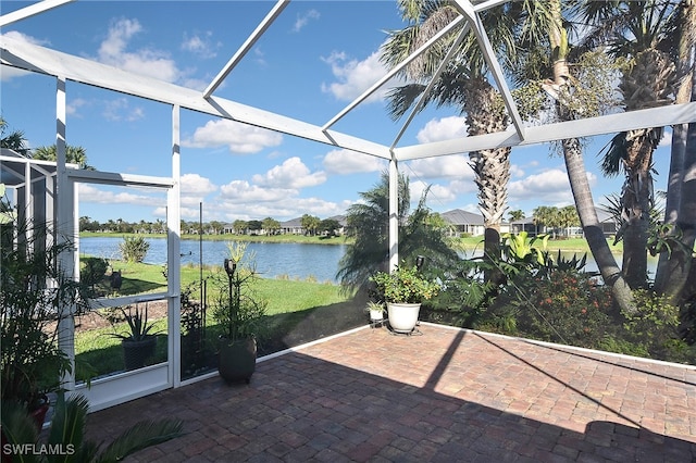 unfurnished sunroom with a water view