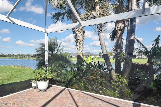 unfurnished sunroom featuring a water view and a healthy amount of sunlight